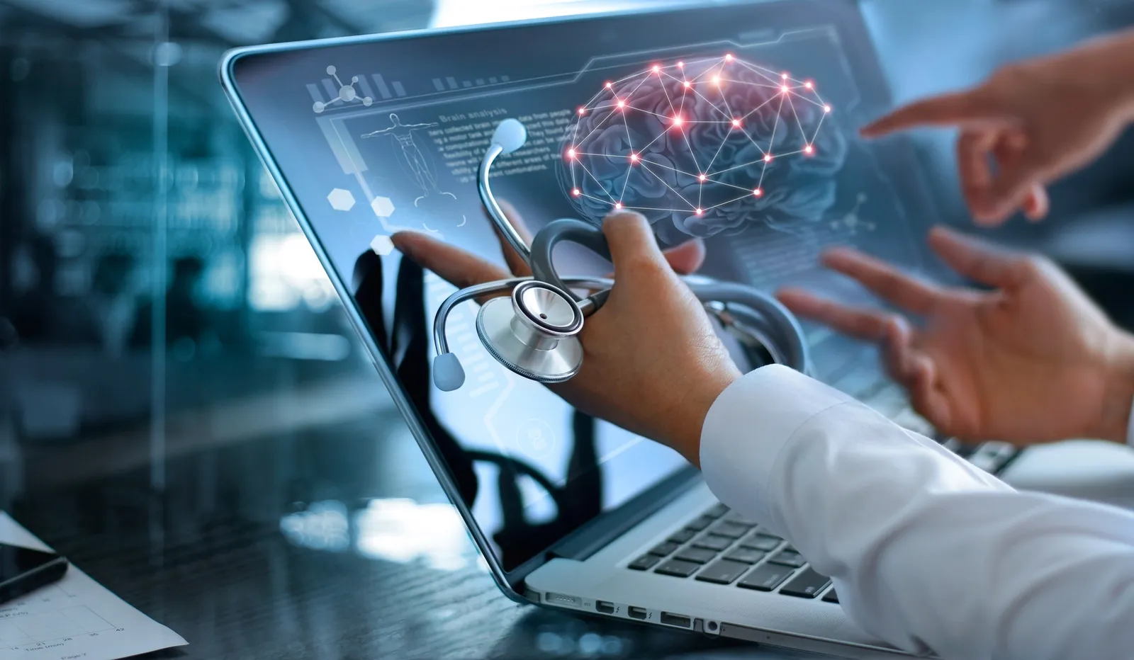 A doctor with a stethoscope reviews an AI network visualisation on a laptop with colleagues